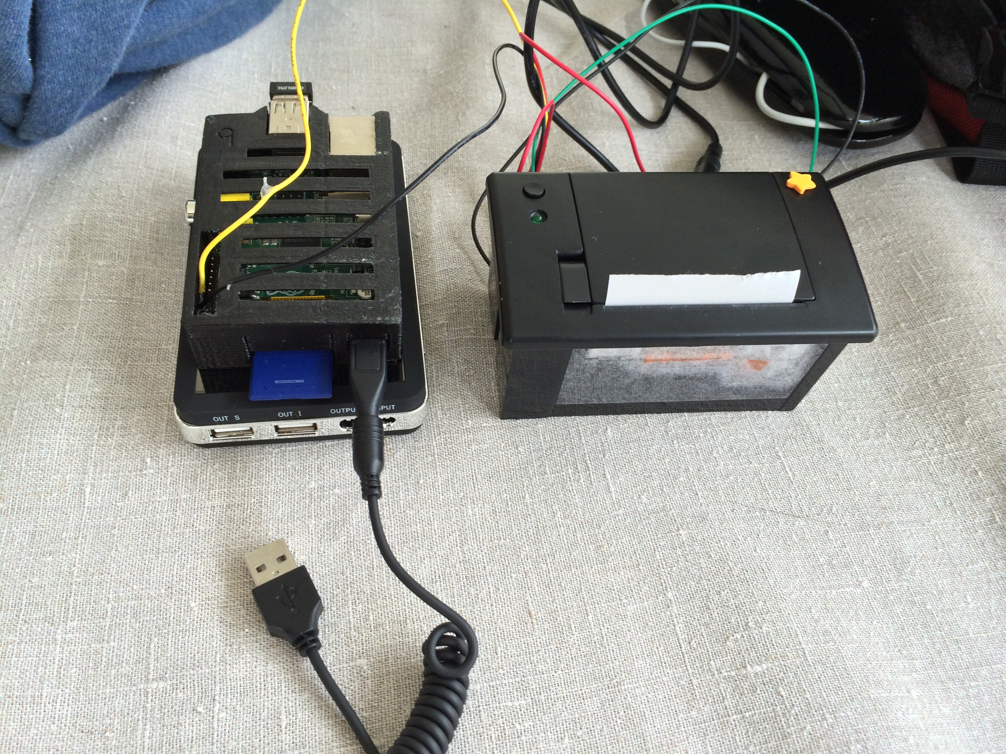 raspberry pi computer running off a battery and connected to a thermal printer